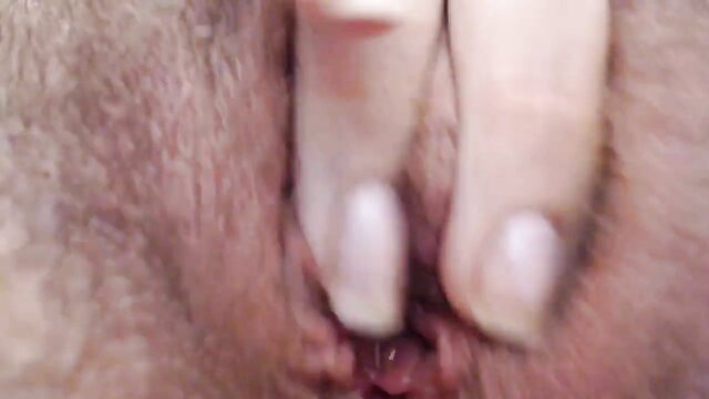 Closeup of a woman masturbating and reaching orgasm on webcam